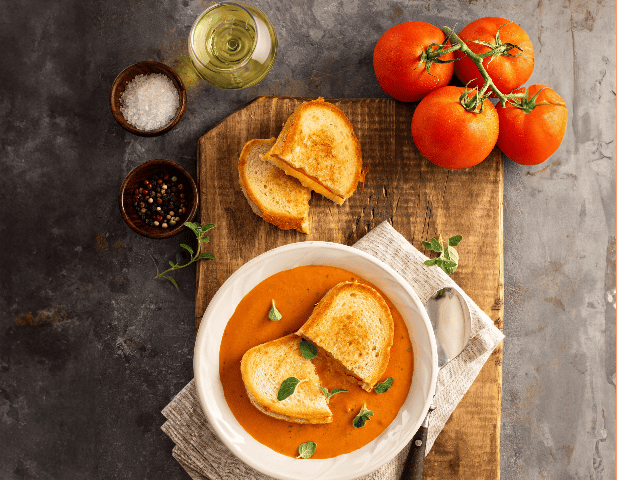 Spanish grilled cheese and smoky cream of tomato soup paired with white wine